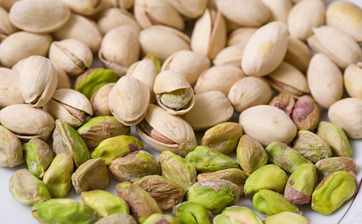 Shelled and unshelled roasted pistachios.