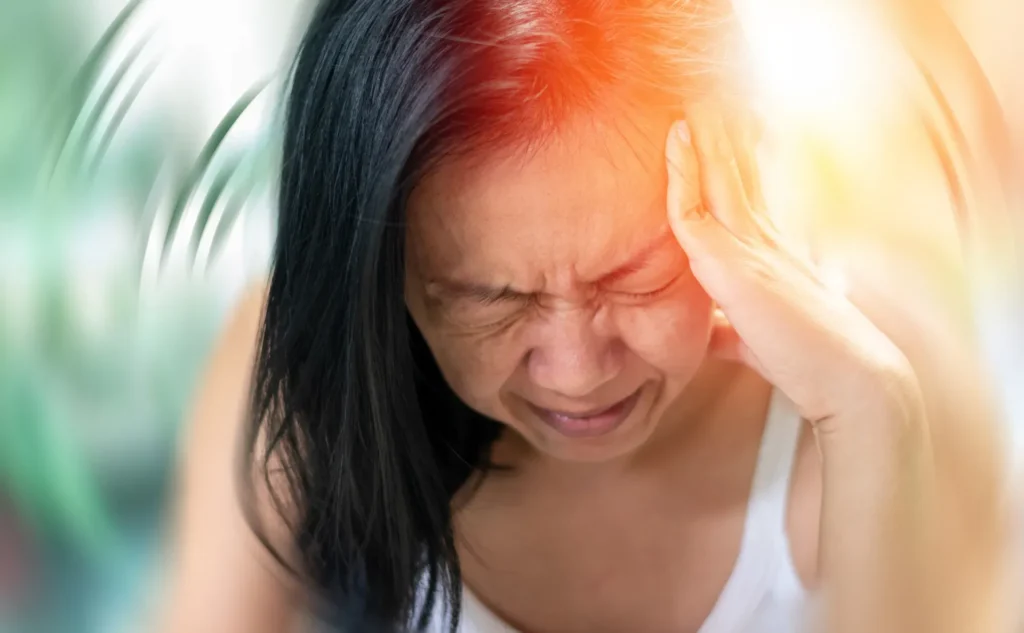 Woman with a migraine and aura