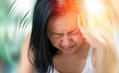 Woman with a migraine and aura